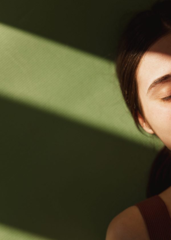 top-view-young-caucasian-beautiful-girl-with-her-eyes-closed-lies-yoga-mat-rests-indoors-teenager-plays-sports-home-about-coronavirus-pandemic-concept-selfisolation-rest